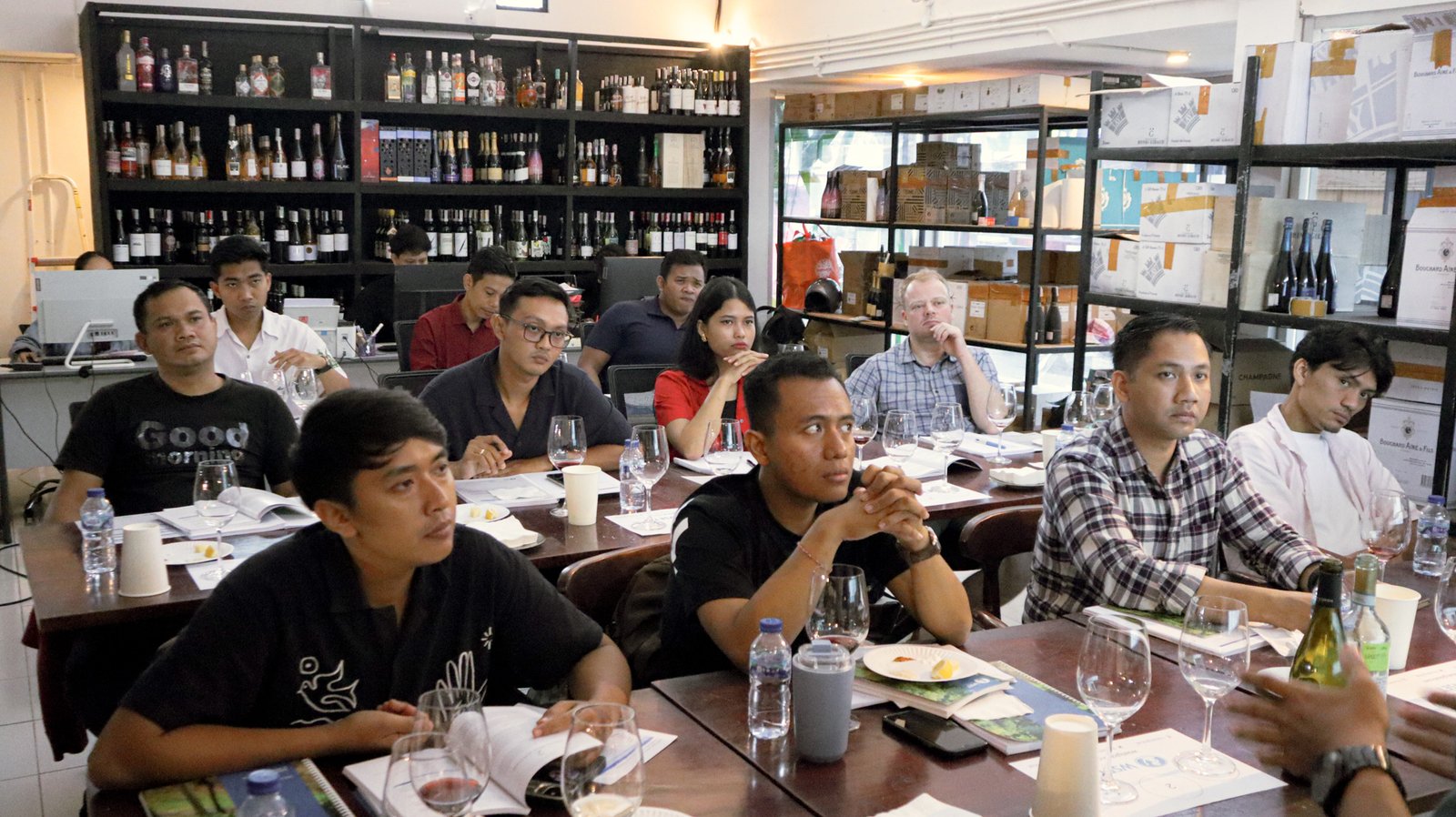 WSET 2 learners comparing wines in structured tasting session